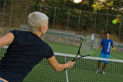 The tennis courts invite you to play a match.